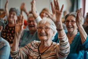 A group of older adults participating in a group activity with supportive staff in a bright, comfortable lounge.